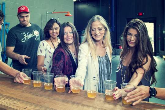 Tour guests sample AIB Beer