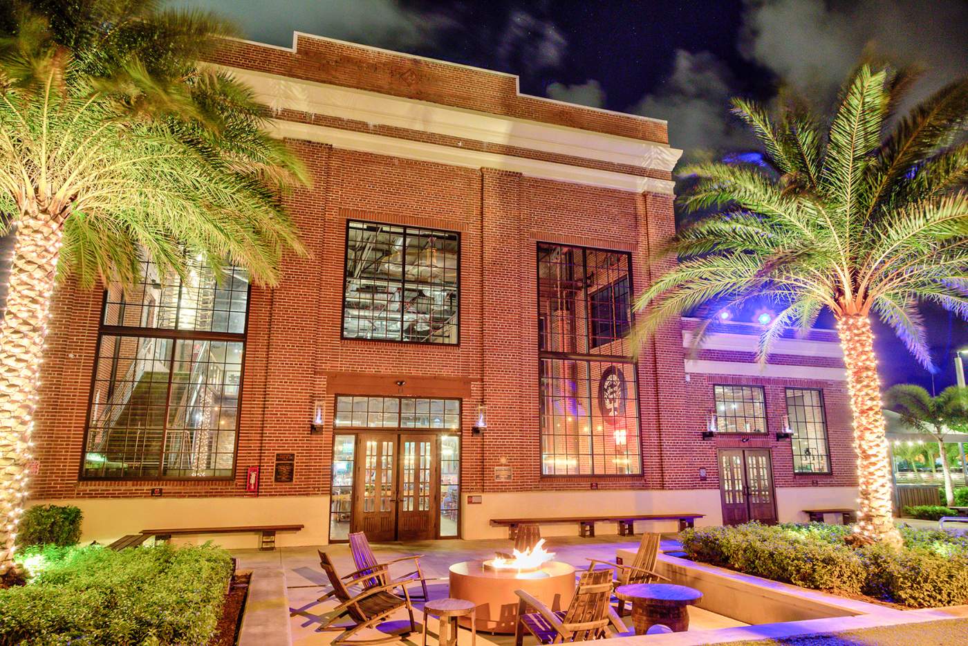 Brewery front of the building at night showing firepit